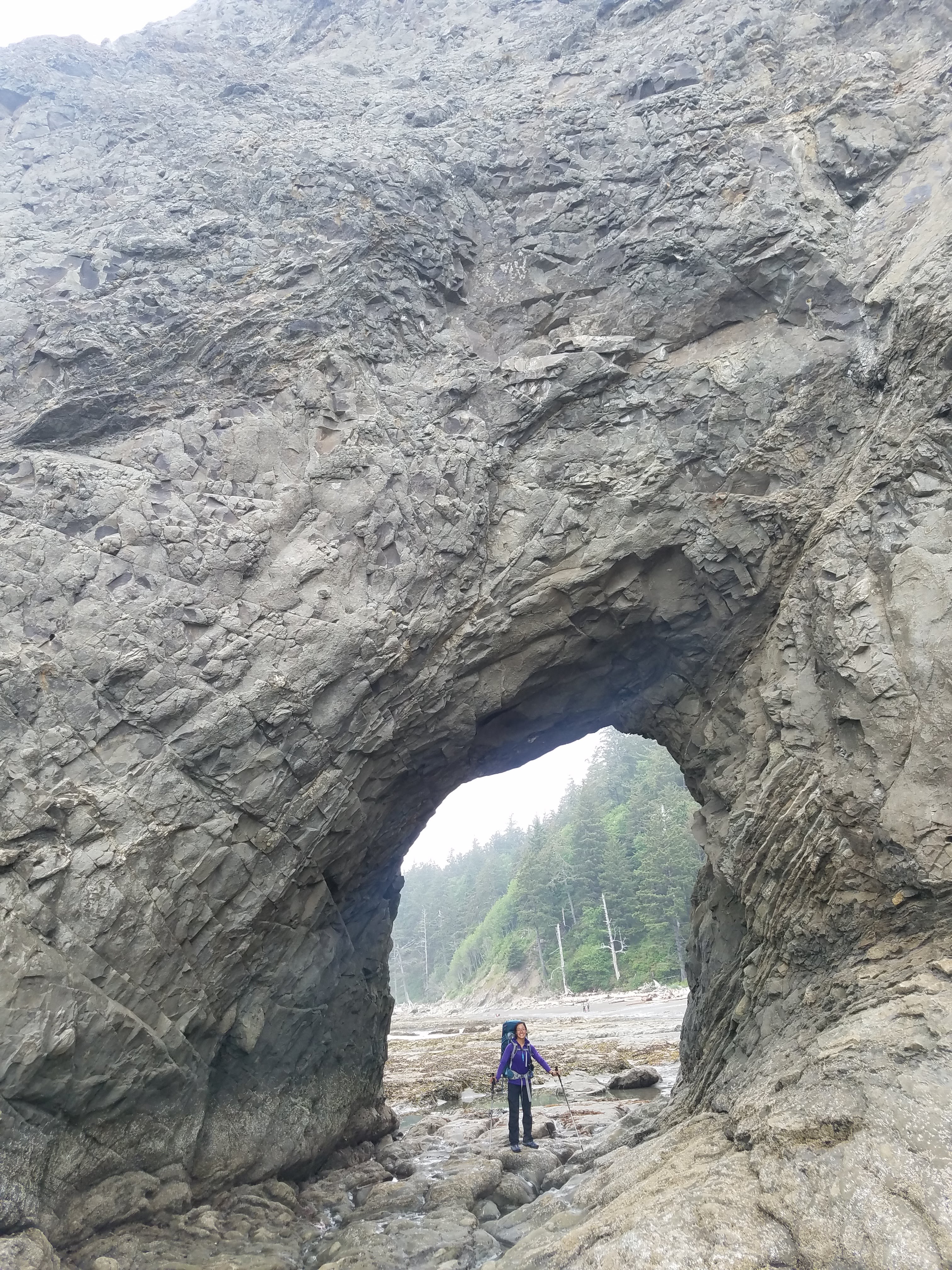 This place is called Hole-In-The-Wall! You can walk through the hole during low tide. Three years ago, I came here with some college friends. It's possible to day hike here from Rialto Beach.