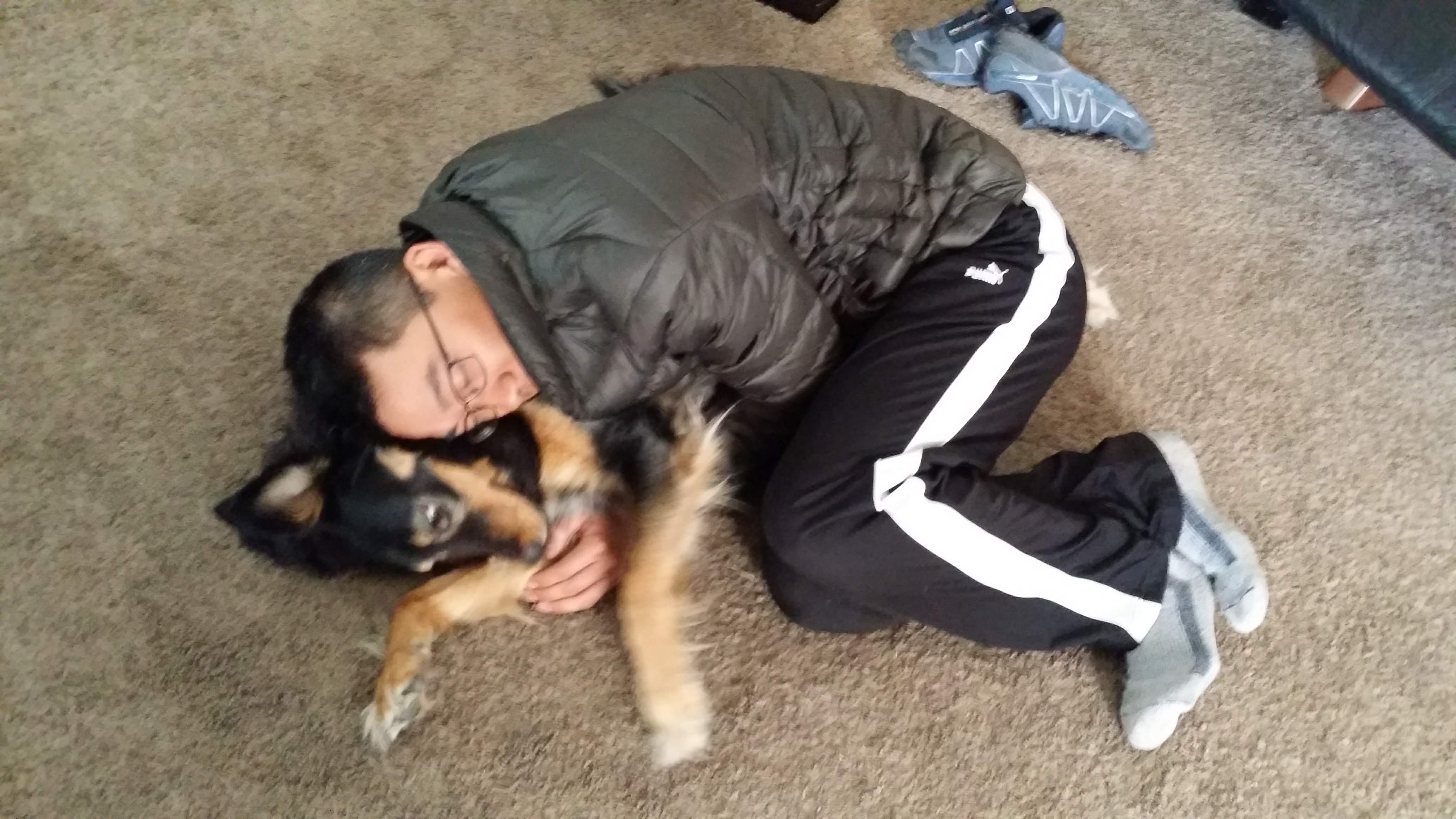 Geoff cuddling with Cheyenne, our sweet Airbnb doggie.